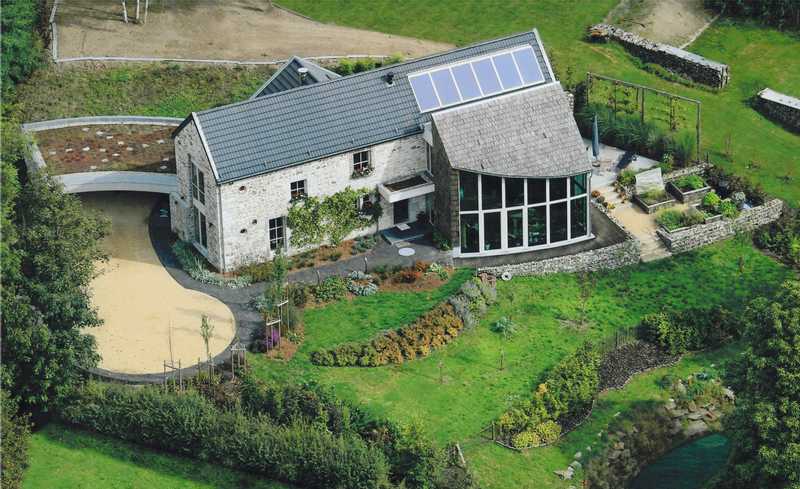 Transformation d'une petite ferme en une habitation unifamiliale